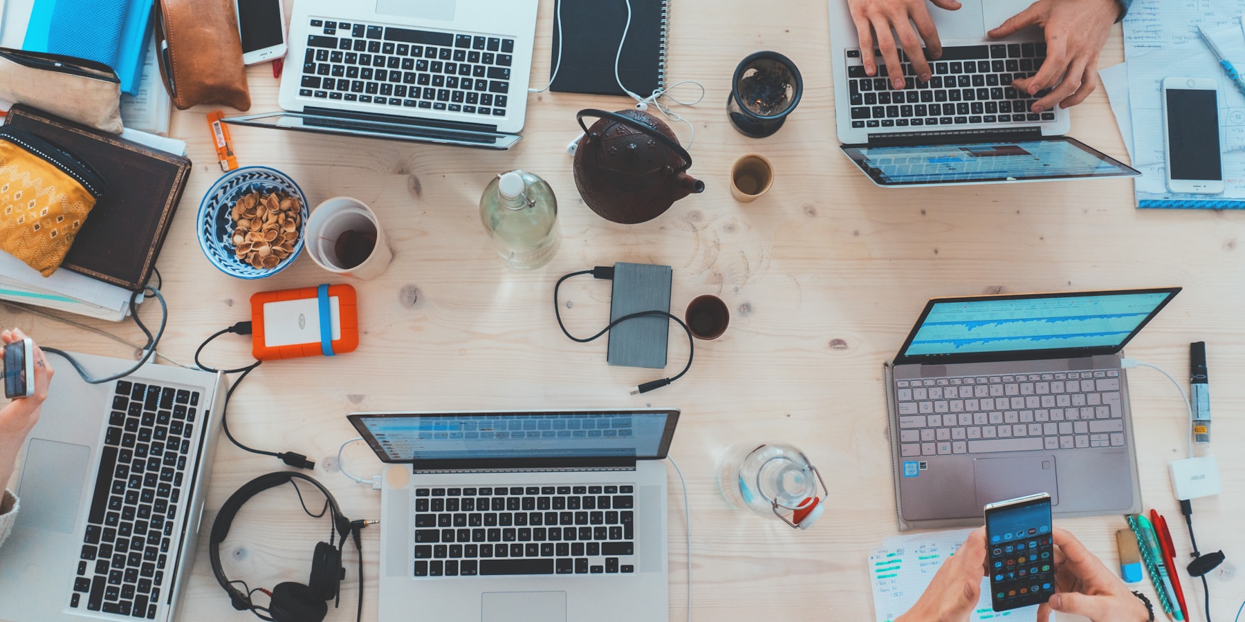 A marketing team reviewing live funnel results together in an open-plan studio